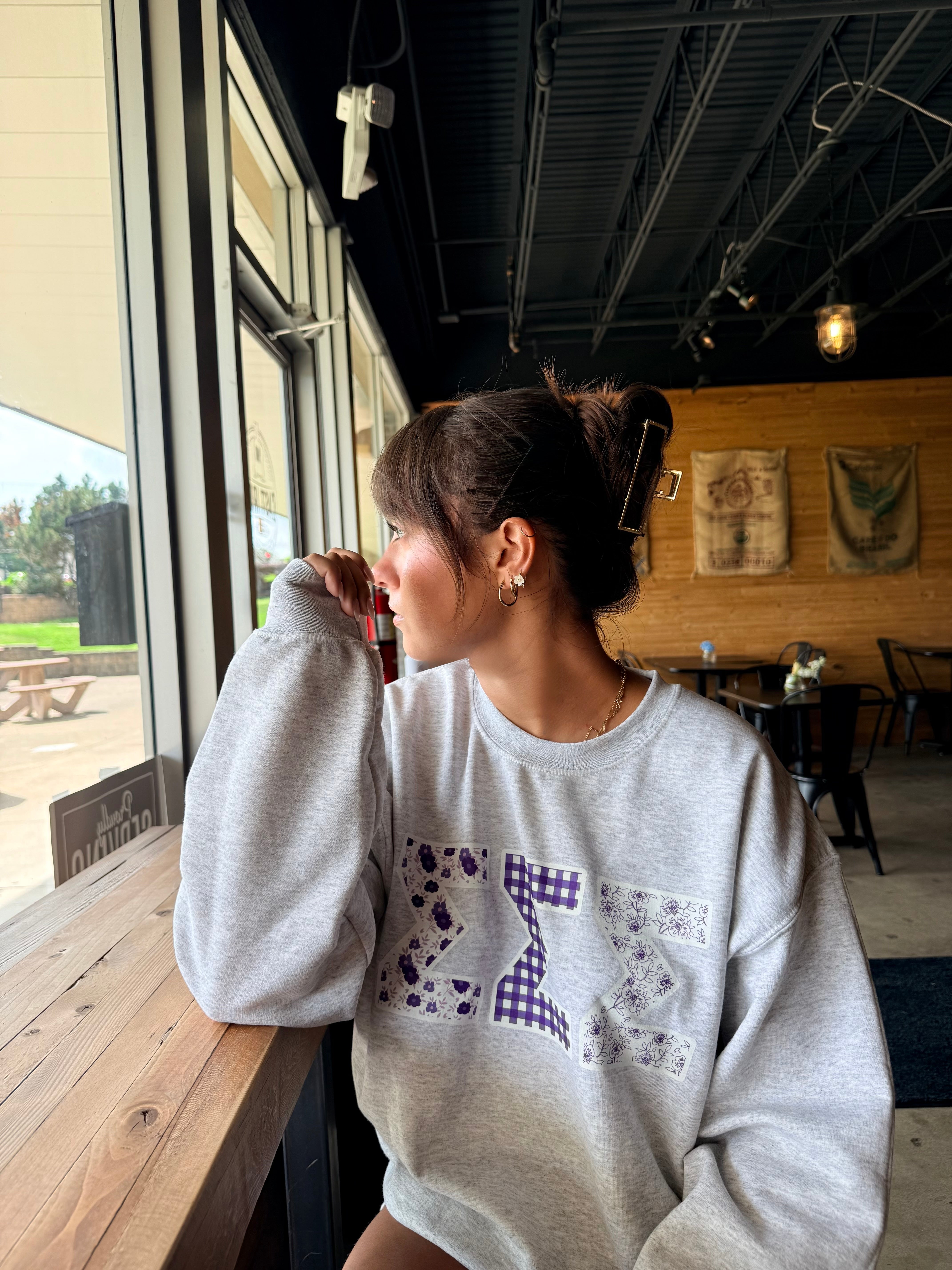 Sigma Sigma Sigma ambassador wearing a South by Sea sweatshirt
