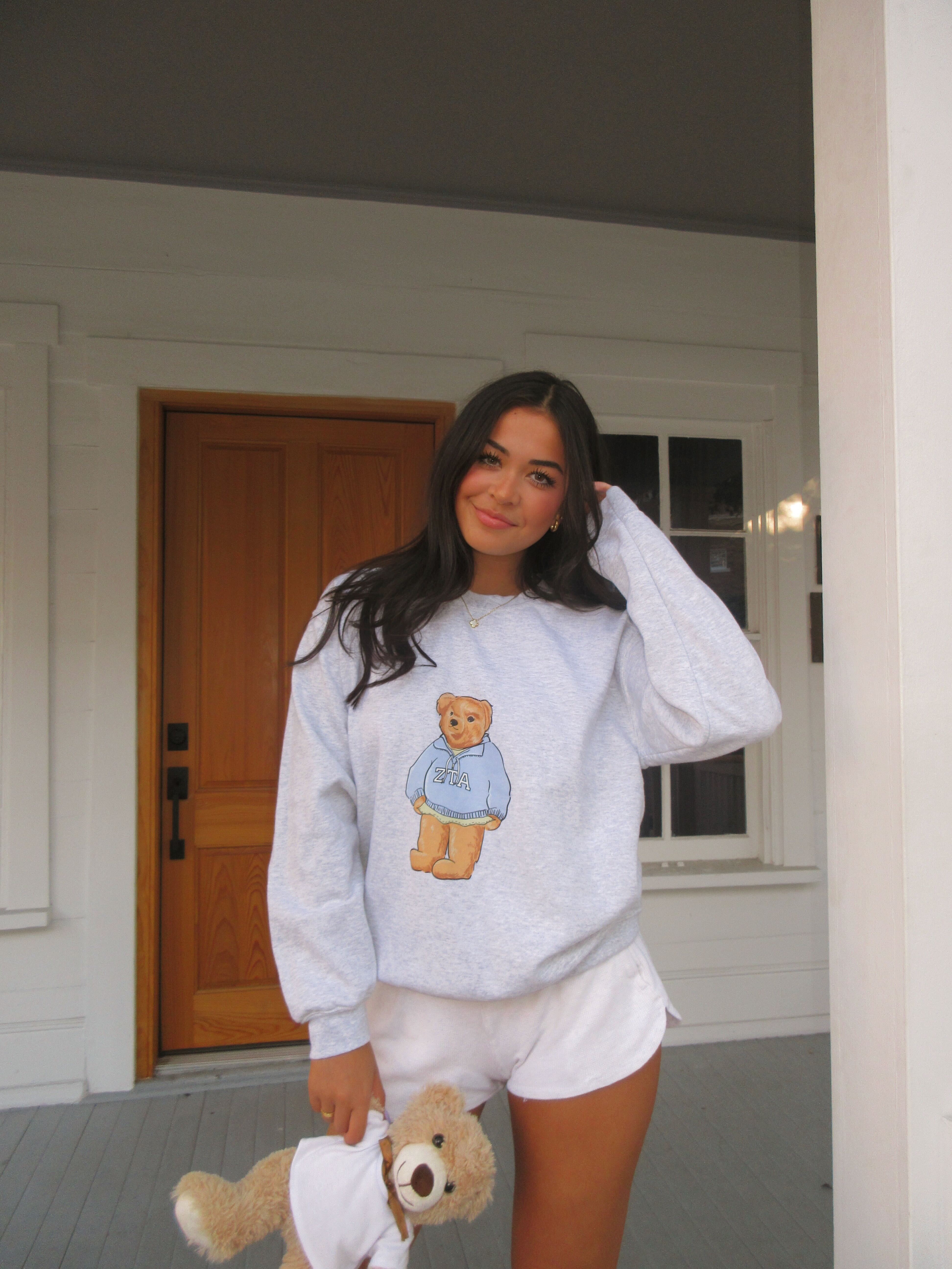 Zeta Tau Alpha ambassador in a South by Sea bear sweatshirt