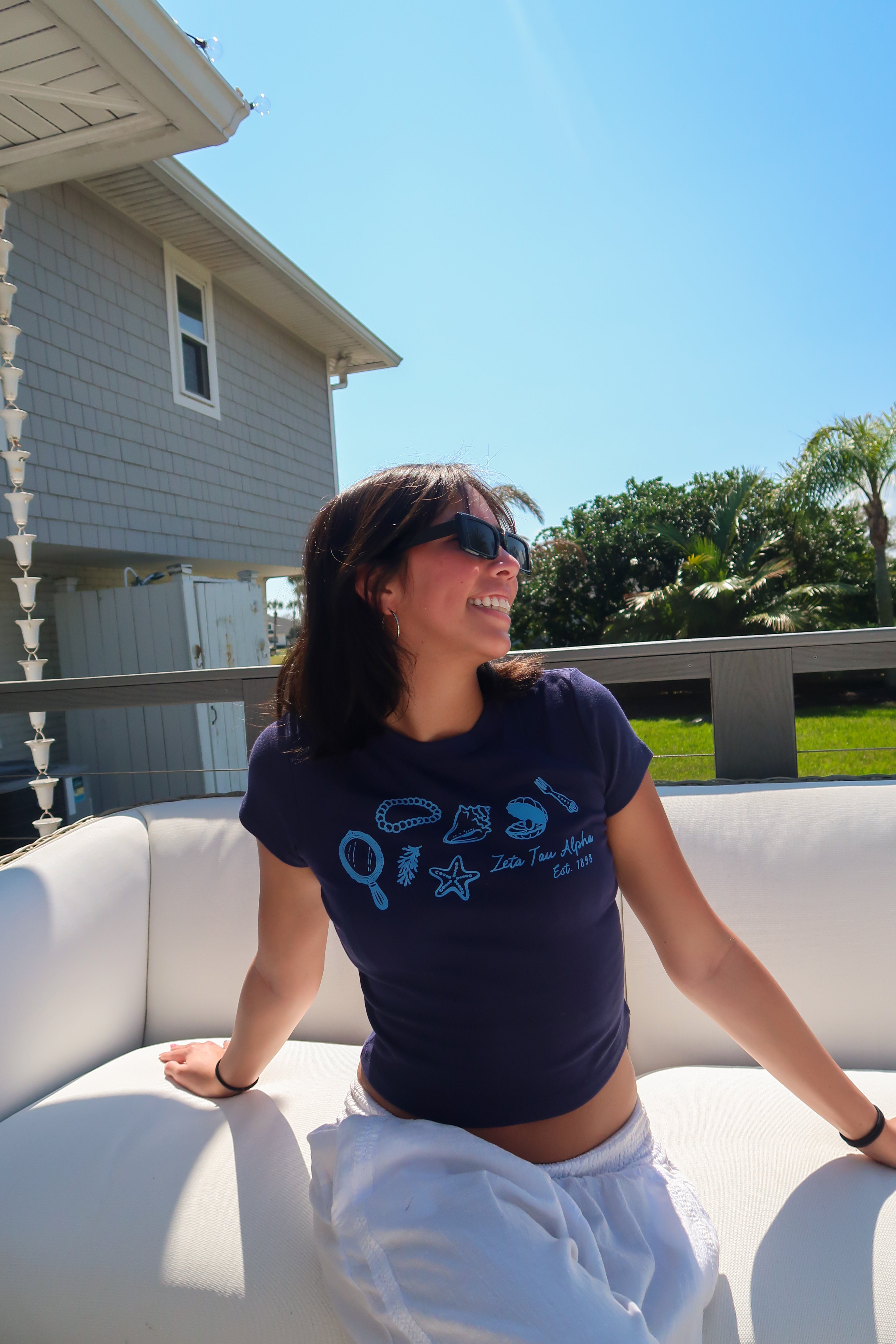 Zeta Tau Alpha ambassador wearing a navy South by Sea tee